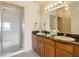 Bathroom with double vanity and shower at 8112 Poinciana Blvd # 1709, Orlando, FL 32821
