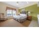 King bedroom with sitting area and view at 8112 Poinciana Blvd # 1709, Orlando, FL 32821