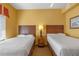 Bedroom with two twin-size beds and nightstand at 8112 Poinciana Blvd # 1709, Orlando, FL 32821