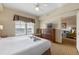 Spacious bedroom with king-size bed and sitting area at 8112 Poinciana Blvd # 1709, Orlando, FL 32821