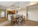 Dining area with a glass-top table and four chairs, situated near the kitchen and entryway at 8112 Poinciana Blvd # 1709, Orlando, FL 32821