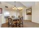 Dining area with glass-top table and four chairs, near the kitchen and entryway at 8112 Poinciana Blvd # 1709, Orlando, FL 32821