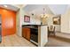 Modern kitchen with wood cabinets, granite countertops, and black appliances at 8112 Poinciana Blvd # 1709, Orlando, FL 32821