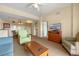 Bright living room with a sofa, armchair, and flat-screen TV at 8112 Poinciana Blvd # 1709, Orlando, FL 32821