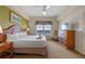 Spacious main bedroom with a king bed and a flat-screen TV at 8112 Poinciana Blvd # 1709, Orlando, FL 32821
