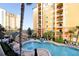 Inviting community pool with surrounding lounge chairs at 8112 Poinciana Blvd # 1709, Orlando, FL 32821