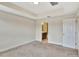 Bedroom with carpet, ensuite bath, and neutral walls at 8419 Lovett Ave, Orlando, FL 32832