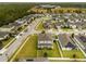 Aerial view of a residential neighborhood with houses and landscaping at 902 Lady Bird Ln, Orange City, FL 32763