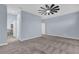 Large bedroom with carpet, ceiling fan and en-suite bathroom at 902 Lady Bird Ln, Orange City, FL 32763