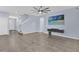 Living room with tile floors and a mounted TV at 902 Lady Bird Ln, Orange City, FL 32763