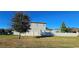 Spacious backyard with a privacy fence and a large grassy area at 3811 Island Green Way, Orlando, FL 32824
