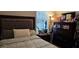 Bedroom with a tufted headboard and large dresser at 3811 Island Green Way, Orlando, FL 32824