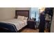 Cozy bedroom with wood-look flooring and window at 3811 Island Green Way, Orlando, FL 32824