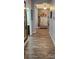 Elegant entryway with wood-look tile flooring and a built-in bench at 3811 Island Green Way, Orlando, FL 32824