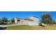 Two-story house with a two-car garage and fenced yard at 3811 Island Green Way, Orlando, FL 32824