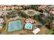 Community overview featuring a pool, tennis courts, and playground at 11410 Rapallo Ln, Windermere, FL 34786