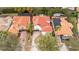 Aerial view of a house with a red tile roof among other houses at 11410 Rapallo Ln, Windermere, FL 34786
