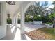 Covered patio overlooks an outdoor basketball court at 11410 Rapallo Ln, Windermere, FL 34786