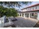 Spacious backyard with a brick patio, basketball court, and water feature at 11410 Rapallo Ln, Windermere, FL 34786