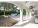 Covered patio with arched columns, offering a shaded outdoor space at 11410 Rapallo Ln, Windermere, FL 34786