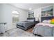 Spacious bedroom with two twin beds, large window, and stylish decor at 11410 Rapallo Ln, Windermere, FL 34786