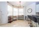 Bright breakfast nook with bay window and seating at 11410 Rapallo Ln, Windermere, FL 34786