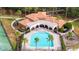 Resort-style community pool with surrounding lounge chairs and playground at 11410 Rapallo Ln, Windermere, FL 34786