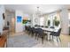 Bright dining room features a large table with seating for eight and access to backyard at 11410 Rapallo Ln, Windermere, FL 34786