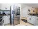 Modern kitchen with stainless steel appliances and granite countertops at 11410 Rapallo Ln, Windermere, FL 34786