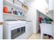 Convenient laundry room with washer, dryer, and extra storage at 11410 Rapallo Ln, Windermere, FL 34786