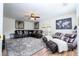 Spacious living room with sectional sofa, large TV, and ceiling fan at 11410 Rapallo Ln, Windermere, FL 34786
