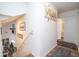 Upstairs hallway with neutral decor and access to other rooms at 11410 Rapallo Ln, Windermere, FL 34786