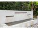 Modern water wall feature with three tiers, adding a tranquil touch to the landscape at 11410 Rapallo Ln, Windermere, FL 34786