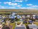 Aerial view showcasing the home's position near the water and surrounding greenery at 25 Cunningham Dr, New Smyrna Beach, FL 32168