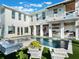 Inviting pool area with lounge chairs, spa, and a white modern farmhouse at 25 Cunningham Dr, New Smyrna Beach, FL 32168
