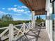 Balcony with water views and white railing, perfect for relaxing at 25 Cunningham Dr, New Smyrna Beach, FL 32168