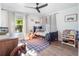 bedroom with blue bed, wooden accents, and playful decor at 25 Cunningham Dr, New Smyrna Beach, FL 32168