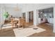 Open-concept dining area adjacent to the kitchen with wood floors and chandelier at 25 Cunningham Dr, New Smyrna Beach, FL 32168