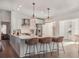 Bright, spacious kitchen with white cabinetry, stainless steel appliances, and an island with seating at 25 Cunningham Dr, New Smyrna Beach, FL 32168