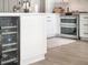 Kitchen detail showcasing the built-in wine cooler and double oven at 25 Cunningham Dr, New Smyrna Beach, FL 32168