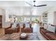 Spacious living room with wood ceiling, leather furniture, and open floor plan at 25 Cunningham Dr, New Smyrna Beach, FL 32168