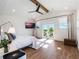 Spacious main bedroom with wood floors, French doors leading to the balcony, and ensuite bathroom access at 25 Cunningham Dr, New Smyrna Beach, FL 32168