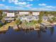 Waterfront home with a dock, boat lift, and views of Ponce Inlet Lighthouse and Disappearing Island at 25 Cunningham Dr, New Smyrna Beach, FL 32168
