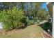 Landscaped backyard with lush greenery at 28023 Cypress Springs Loop, Okahumpka, FL 34762