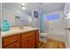 Guest bathroom with tub and single vanity at 28023 Cypress Springs Loop, Okahumpka, FL 34762