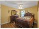 Bedroom with wood furniture and ceiling fan at 28023 Cypress Springs Loop, Okahumpka, FL 34762
