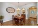 Elegant dining room featuring a wooden table and hardwood flooring at 28023 Cypress Springs Loop, Okahumpka, FL 34762