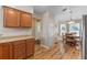 Kitchen with wood cabinets, view of entryway and breakfast nook at 28023 Cypress Springs Loop, Okahumpka, FL 34762