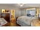 Main bedroom with ensuite bathroom and access to screened porch at 28023 Cypress Springs Loop, Okahumpka, FL 34762