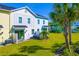 Aerial view of colorful townhomes with private yards at 2956 Caribbean Soul Dr, Kissimmee, FL 34747